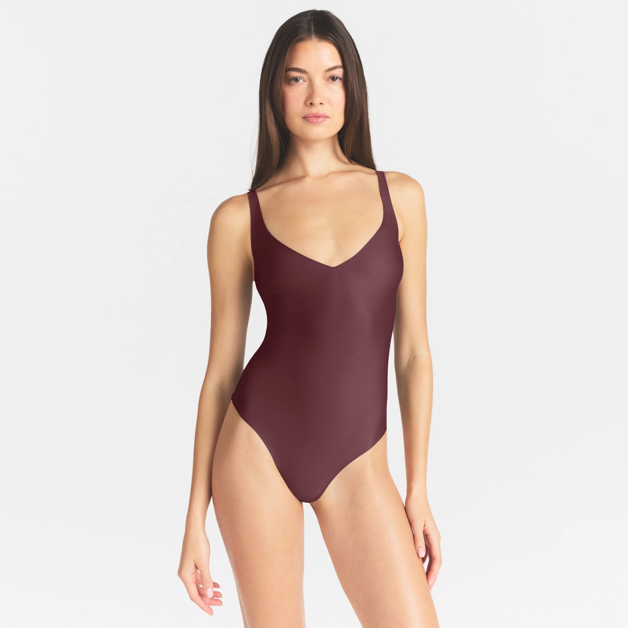 SKIMS BODY UNLINED PLUNGE THONG BODYSUIT | CURRANT