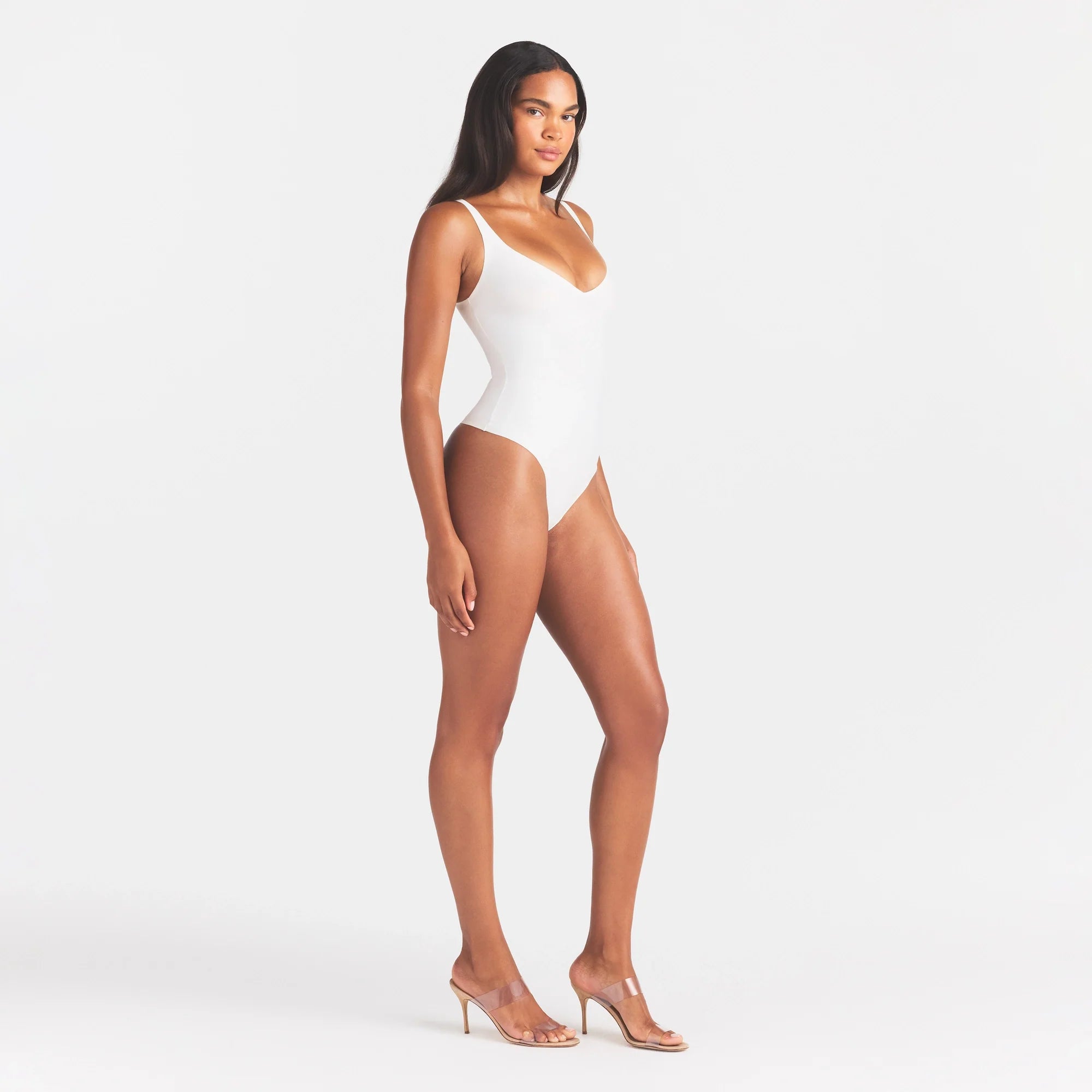 SKIMS BODY UNLINED PLUNGE THONG BODYSUIT | IVORY