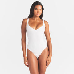 SKIMS BODY UNLINED PLUNGE THONG BODYSUIT | IVORY